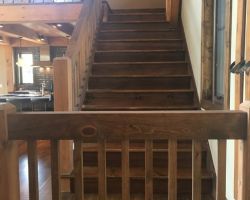 The stair is built of Eastern White Pine it fits in perfectly with the wide plank white pine floors that were installed in this timber frame home.
